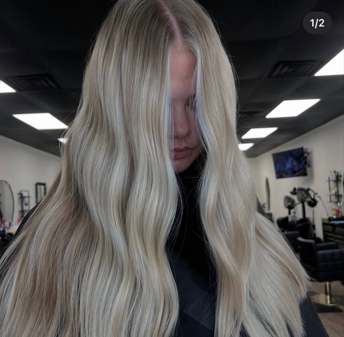 Long platinum blonde hair with dimensional waves by The Hair Collective Oklahoma City